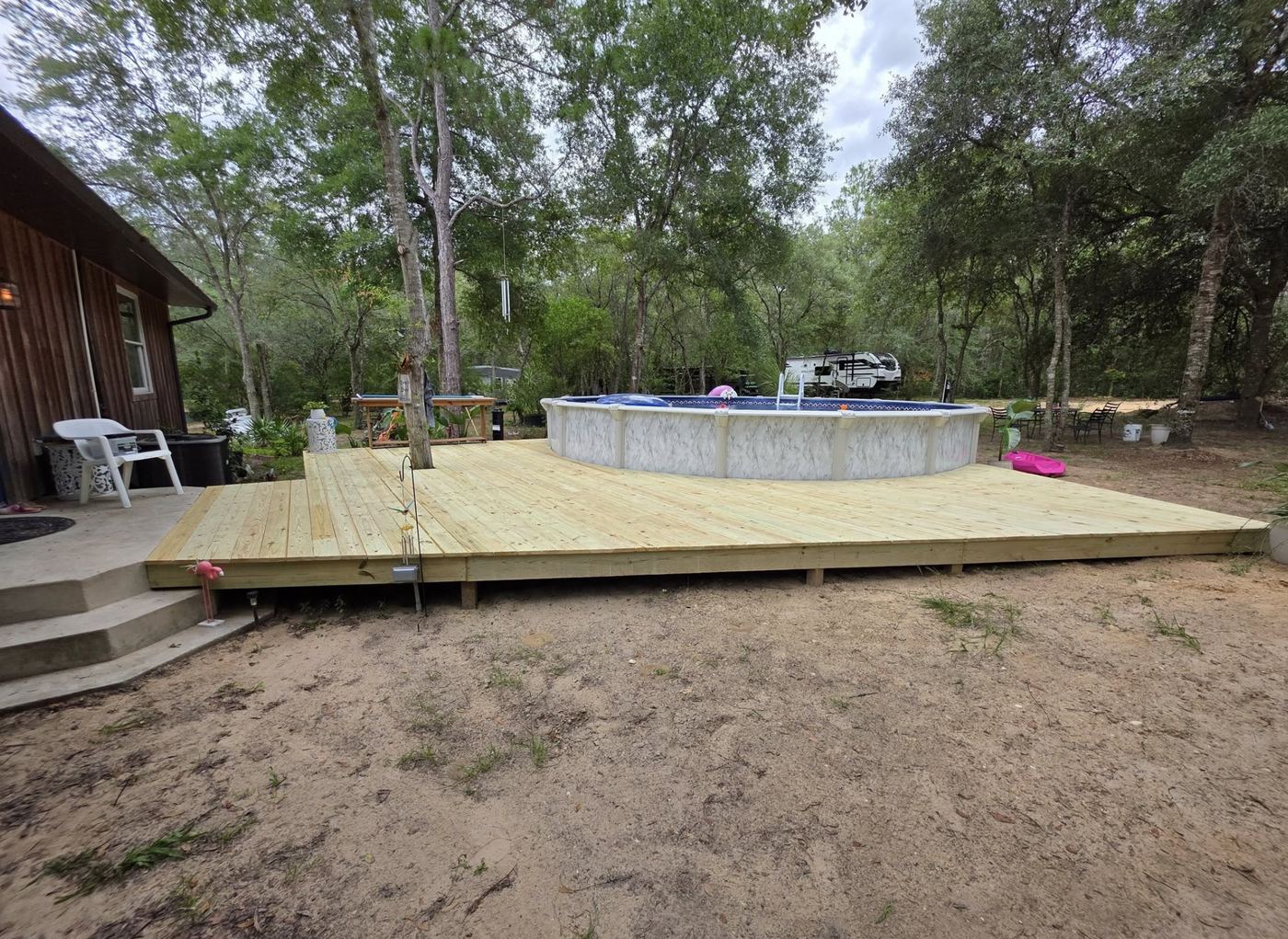 Wood deck build around pool by MAXXPRO
